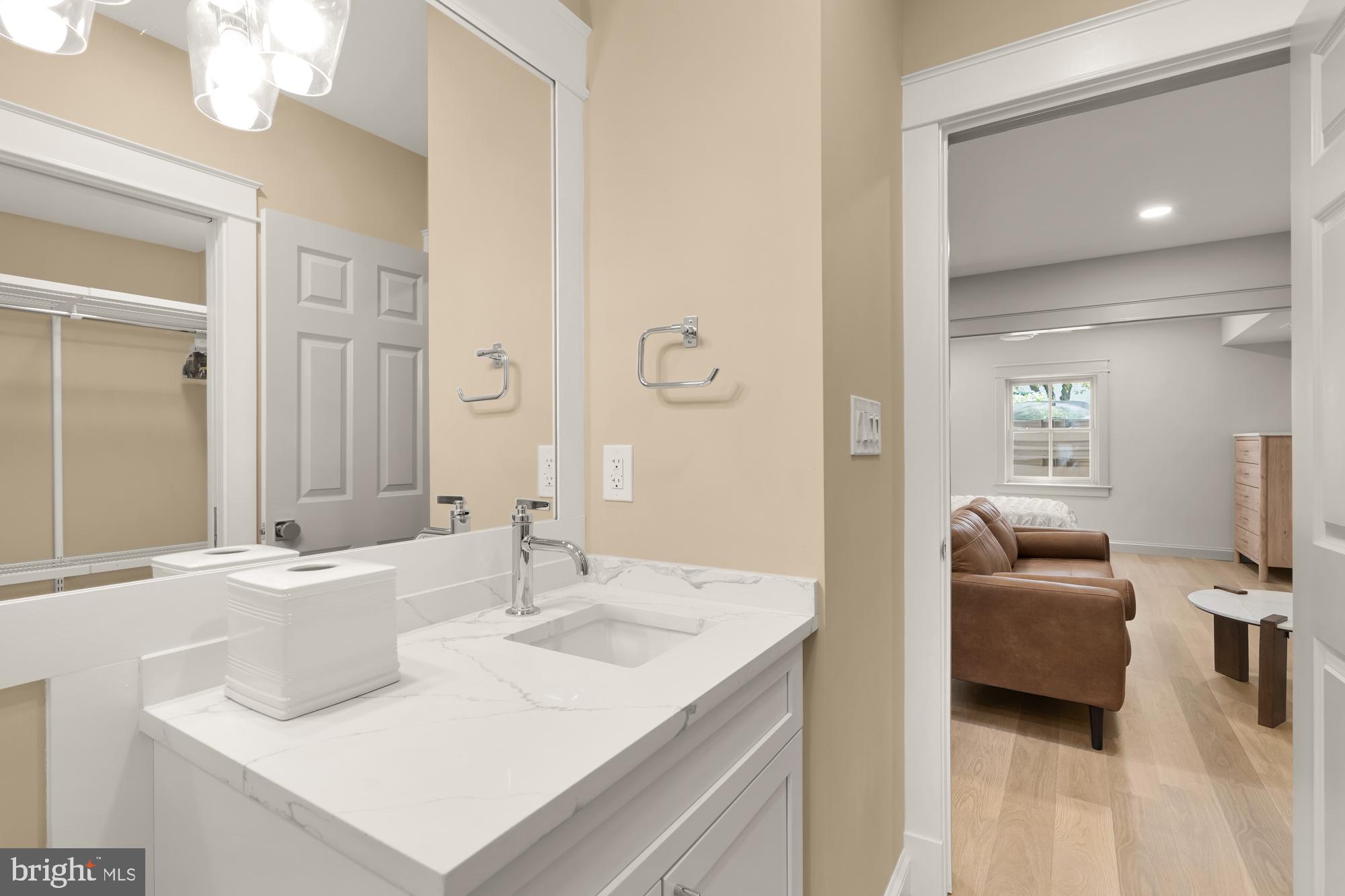 4111 18th Road North, Unit 1 Arlington, VA 22207 - Photo 10 of 16 a en suite bathroom with a sink and a mirror