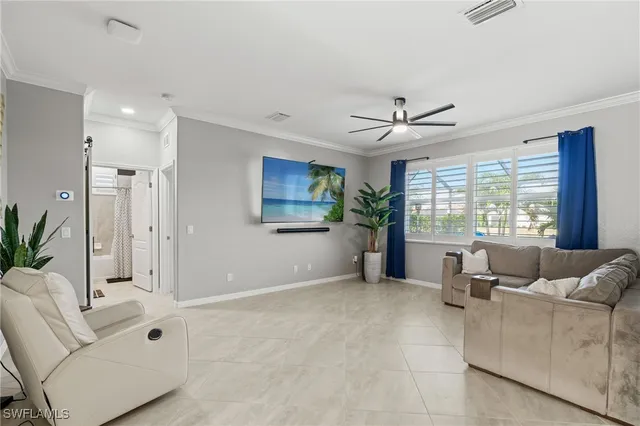 a living room with furniture and windows