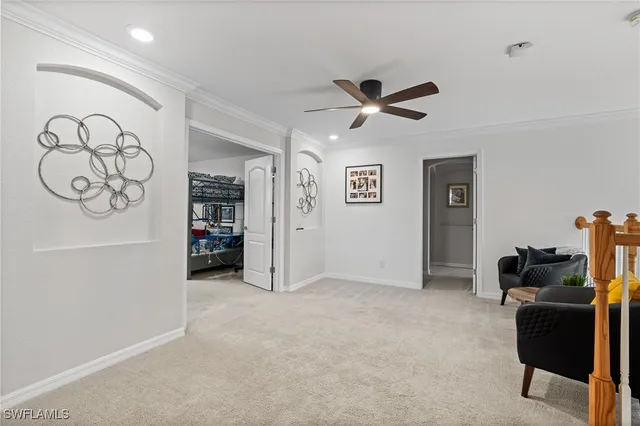 a view of work space with furniture and a ceiling fan