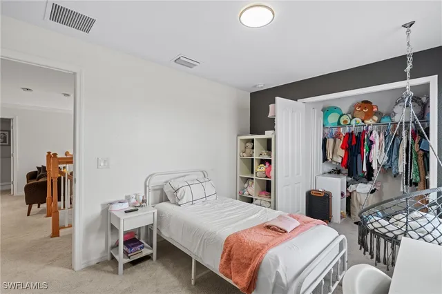 a bedroom with a bed and a walk in closet
