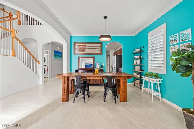 a dining room with furniture window and entryway