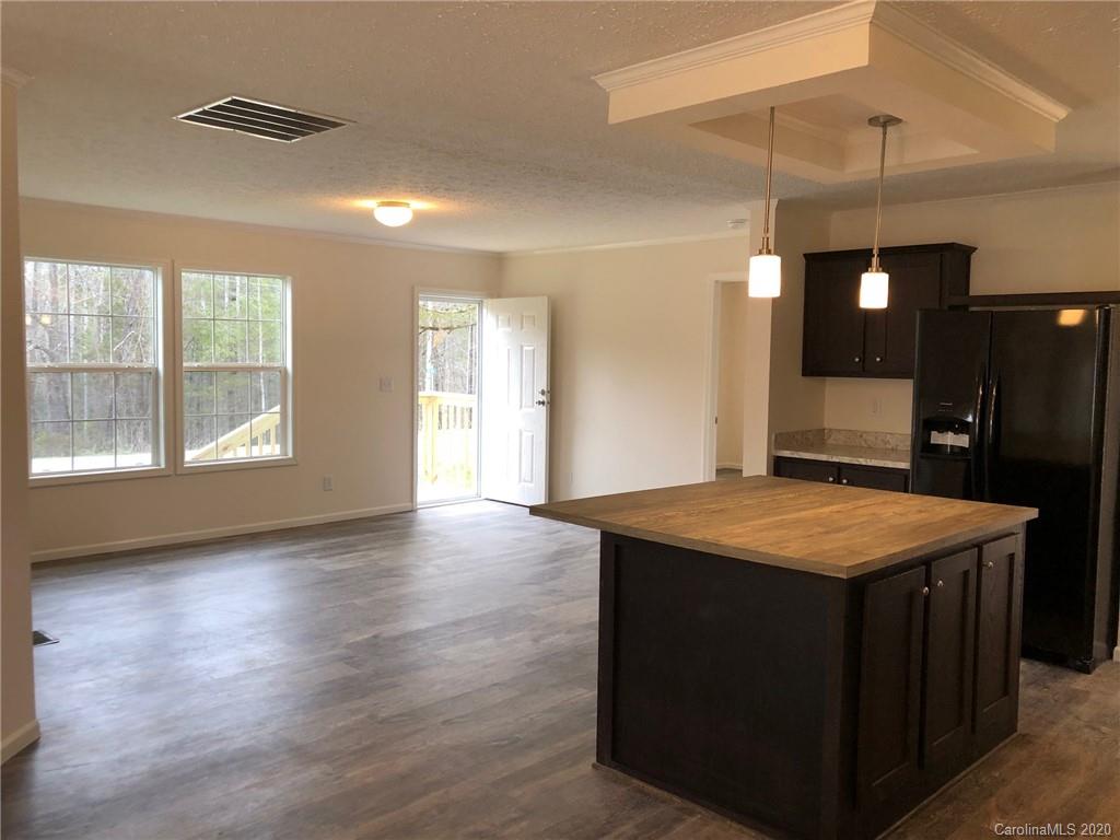 296 Souther Road Fletcher, NC 28732 - Photo 13 of 25 a kitchen with a stove and a refrigerator