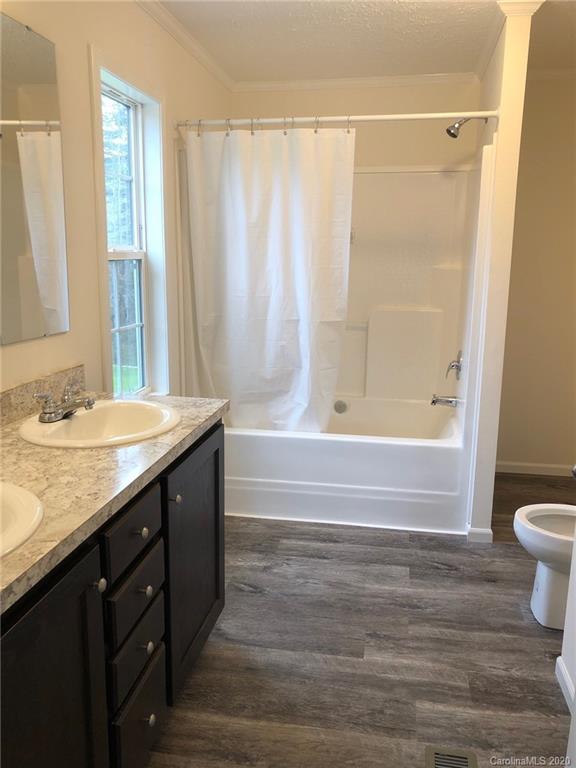 296 Souther Road Fletcher, NC 28732 - Photo 21 of 25 a bathroom with a granite countertop sink toilet and shower
