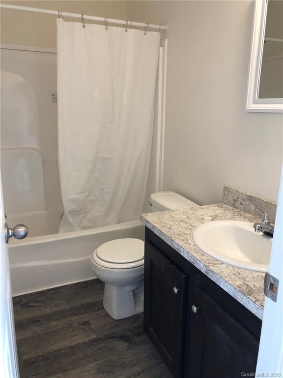 296 Souther Road Fletcher, NC 28732 - Photo 24 of 25 a bathroom with a granite countertop sink toilet and shower