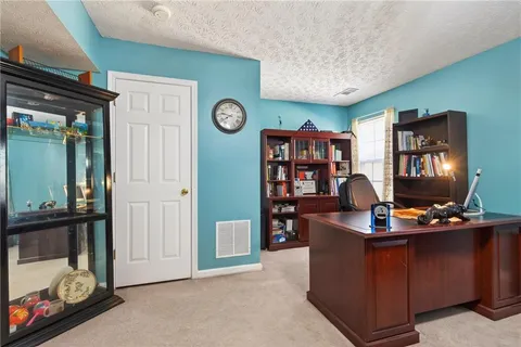 a bedroom with furniture and a dresser