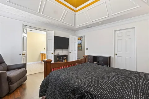 a bathroom with a toilet a sink a mirror and vanity