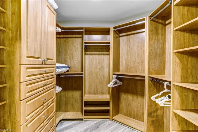a bathroom with a window and a walk in closet