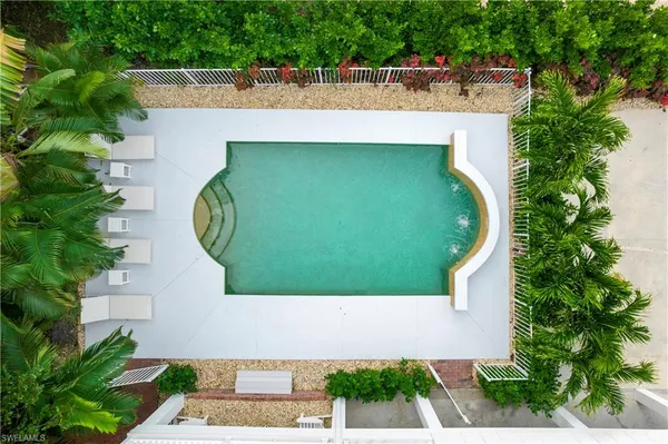an aerial view of a house with a swimming pool