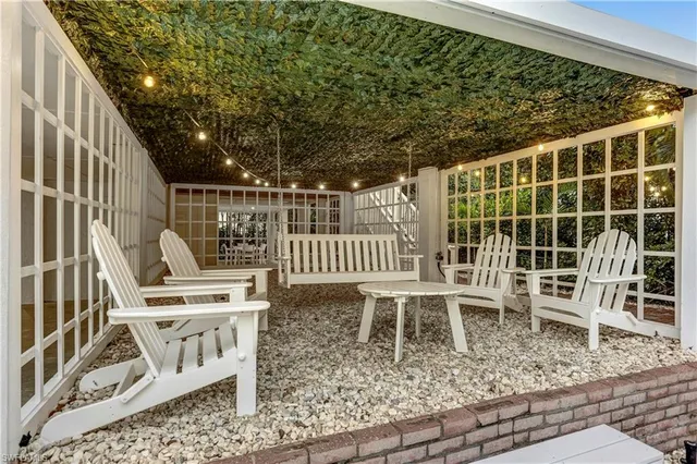 a view of a chair and table in the balcony