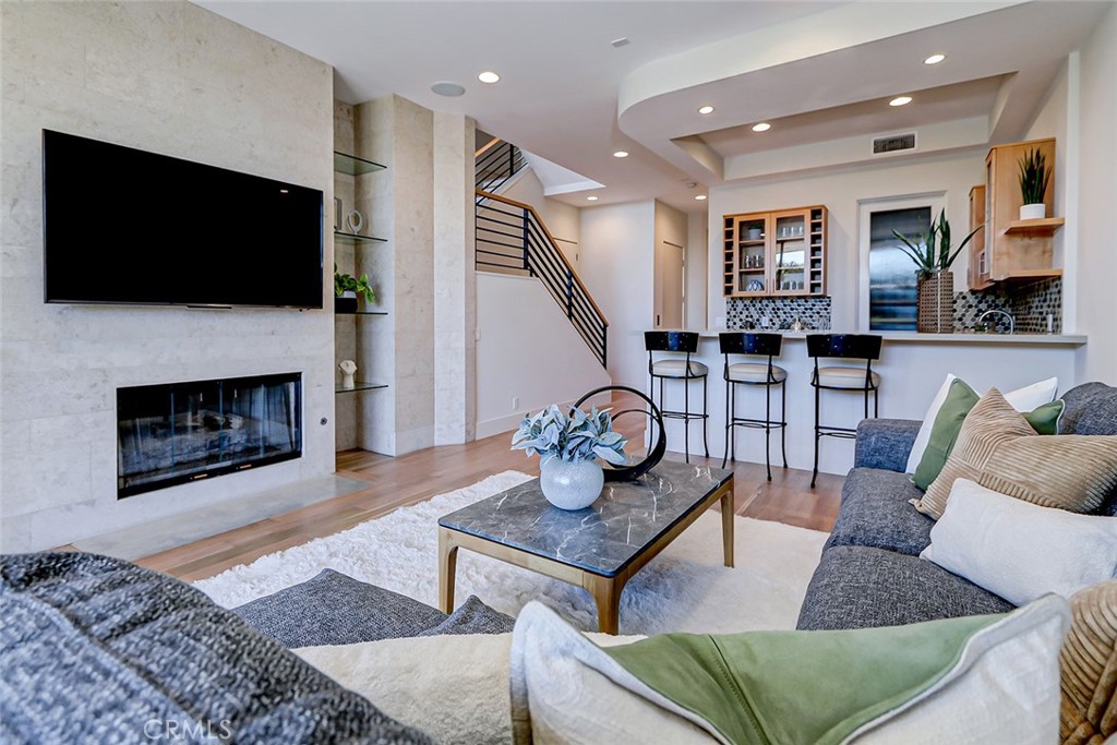 425 26th Street Manhattan Beach, CA 90266 - Photo 12 of 55 a living room with furniture and a flat screen tv