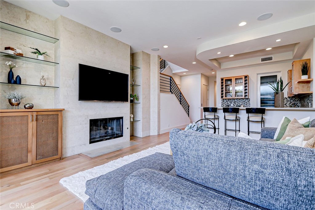 425 26th Street Manhattan Beach, CA 90266 - Photo 14 of 55 a living room with fireplace furniture and a flat screen tv