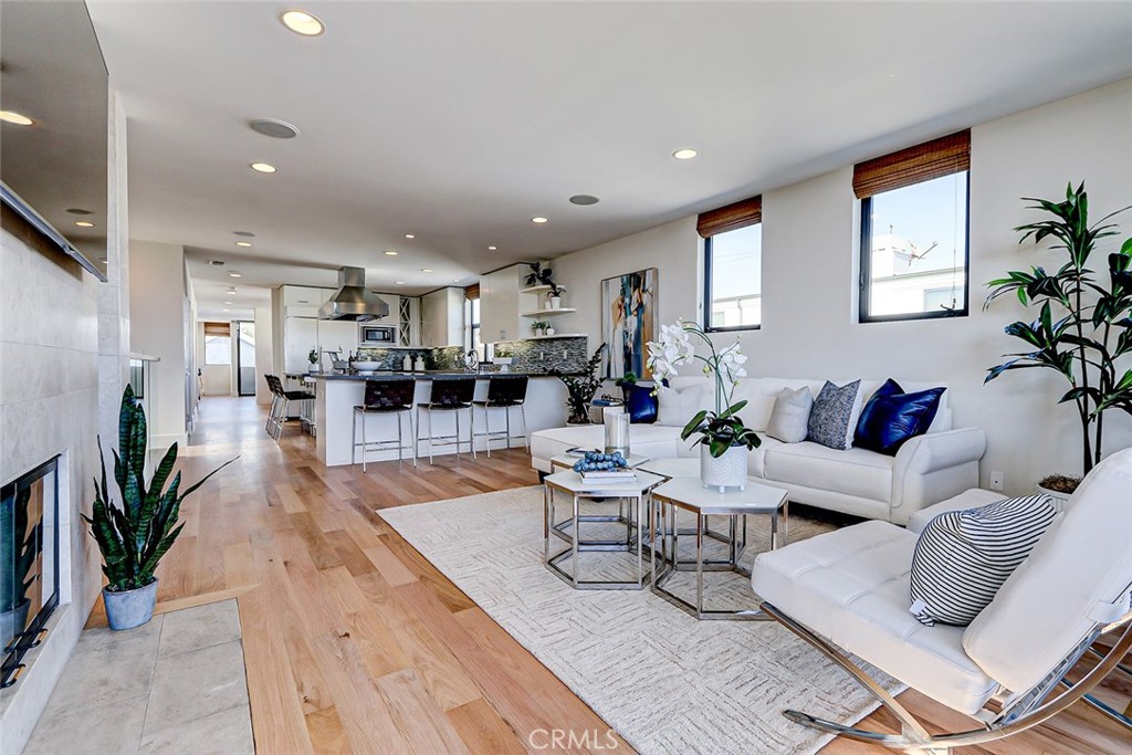 425 26th Street Manhattan Beach, CA 90266 - Photo 24 of 55 a living room with furniture and a wooden floor