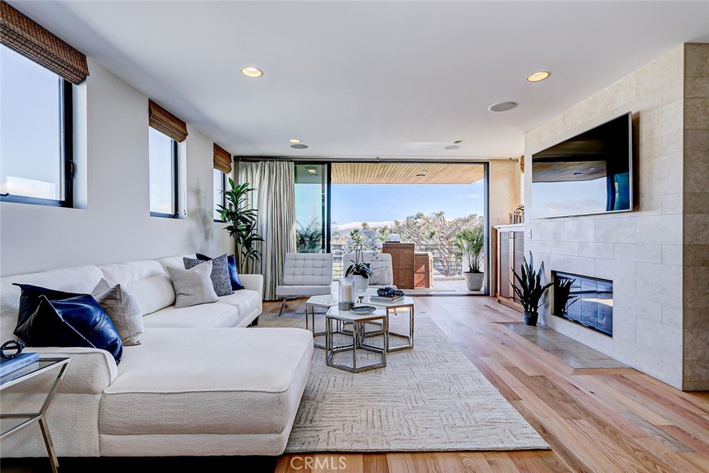 425 26th Street Manhattan Beach, CA 90266 - Photo 26 of 55 a living room with furniture and a fireplace