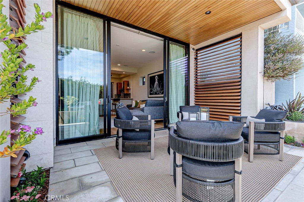 425 26th Street Manhattan Beach, CA 90266 - Photo 3 of 55 a balcony with furniture and flowers