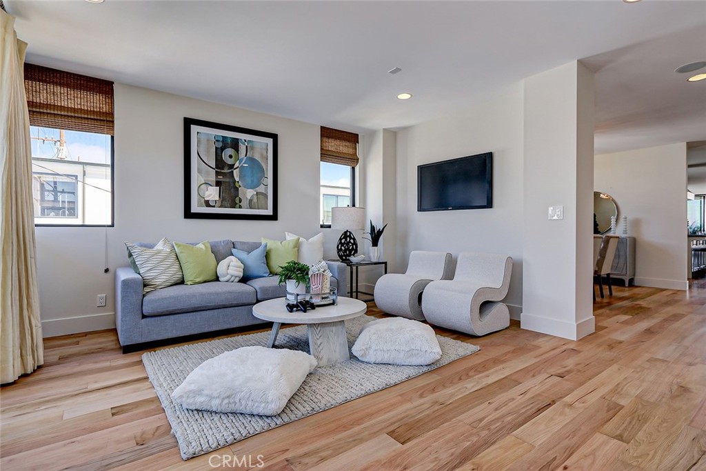 425 26th Street Manhattan Beach, CA 90266 - Photo 34 of 55 a living room with furniture flat screen tv and wooden floor
