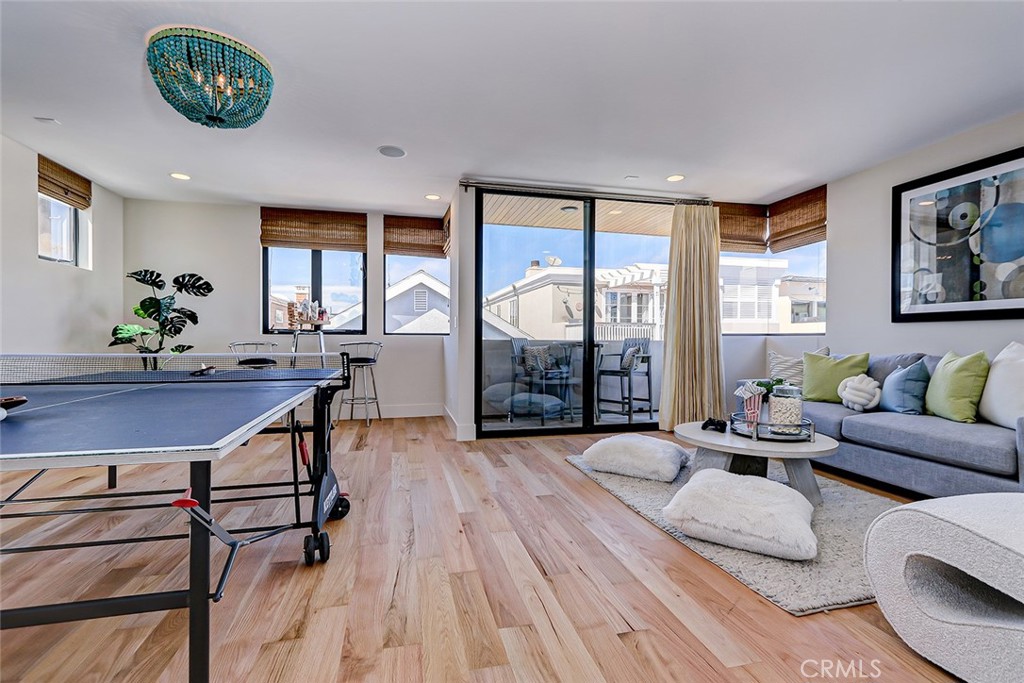 425 26th Street Manhattan Beach, CA 90266 - Photo 36 of 55 a living room with furniture a wooden floor and a table