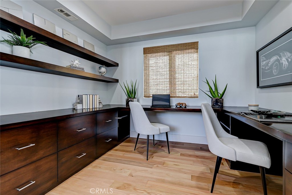 425 26th Street Manhattan Beach, CA 90266 - Photo 39 of 55 a living room with furniture and wooden floor