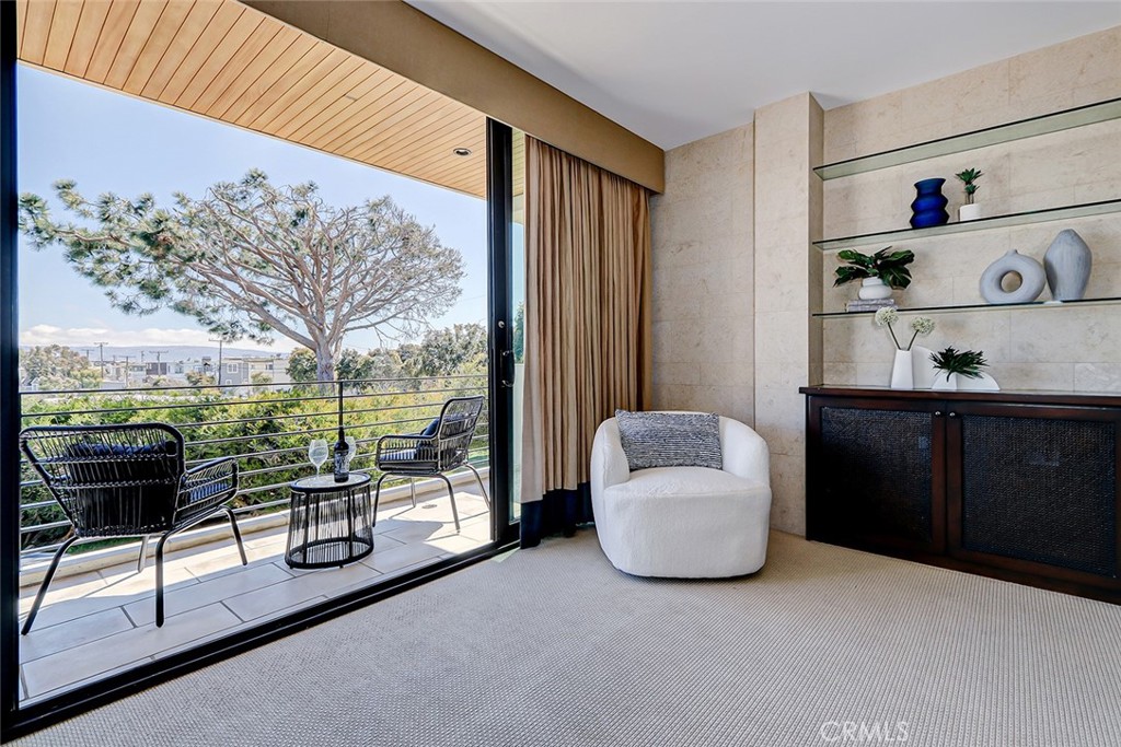 425 26th Street Manhattan Beach, CA 90266 - Photo 43 of 55 a living room with furniture and a floor to ceiling window