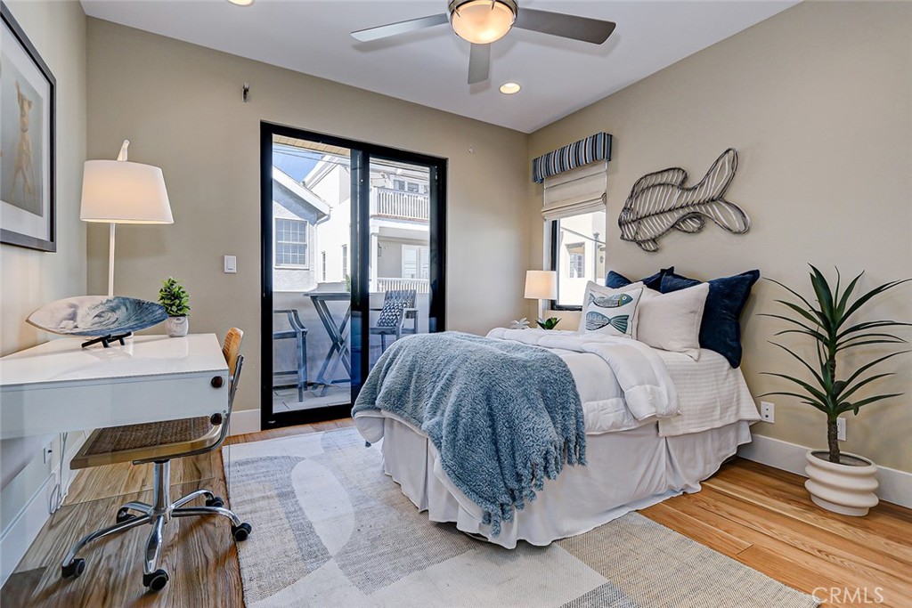 425 26th Street Manhattan Beach, CA 90266 - Photo 49 of 55 a bedroom with a large bed and a chandelier