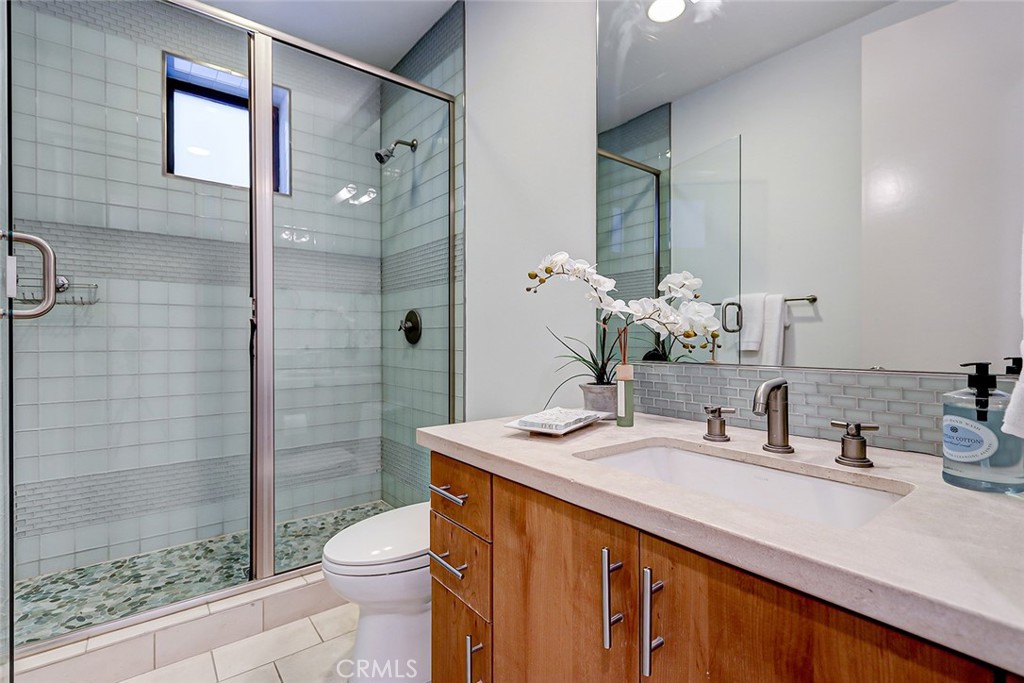 425 26th Street Manhattan Beach, CA 90266 - Photo 50 of 55 a bathroom with a double vanity sink toilet and shower