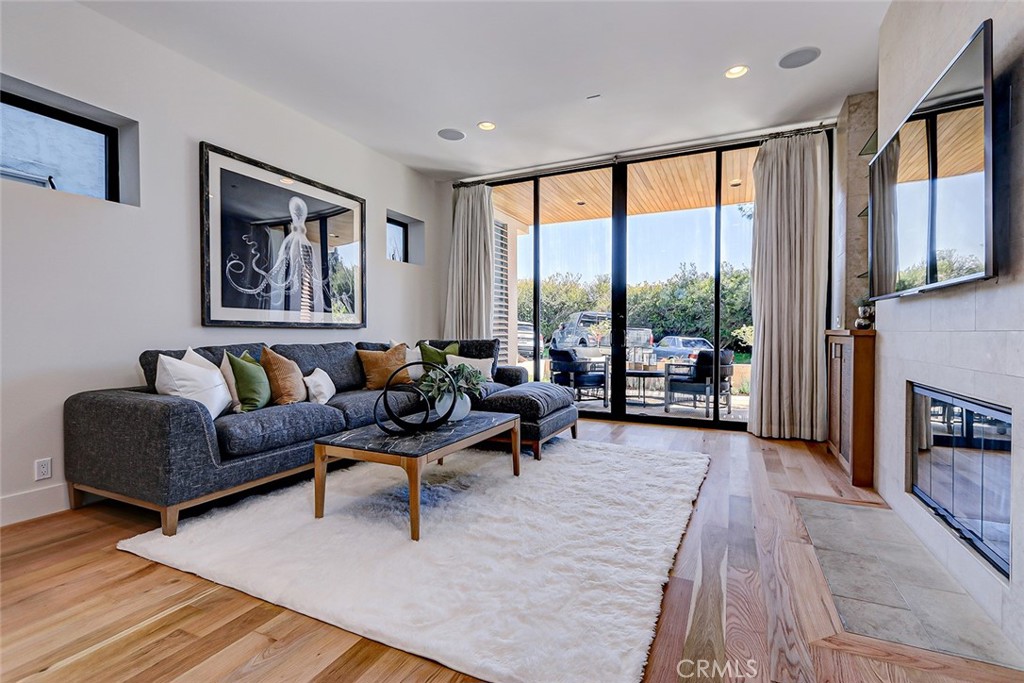 425 26th Street Manhattan Beach, CA 90266 - Photo 10 of 55 a living room with furniture and a fireplace