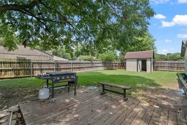 a house view with a sitting space and garden