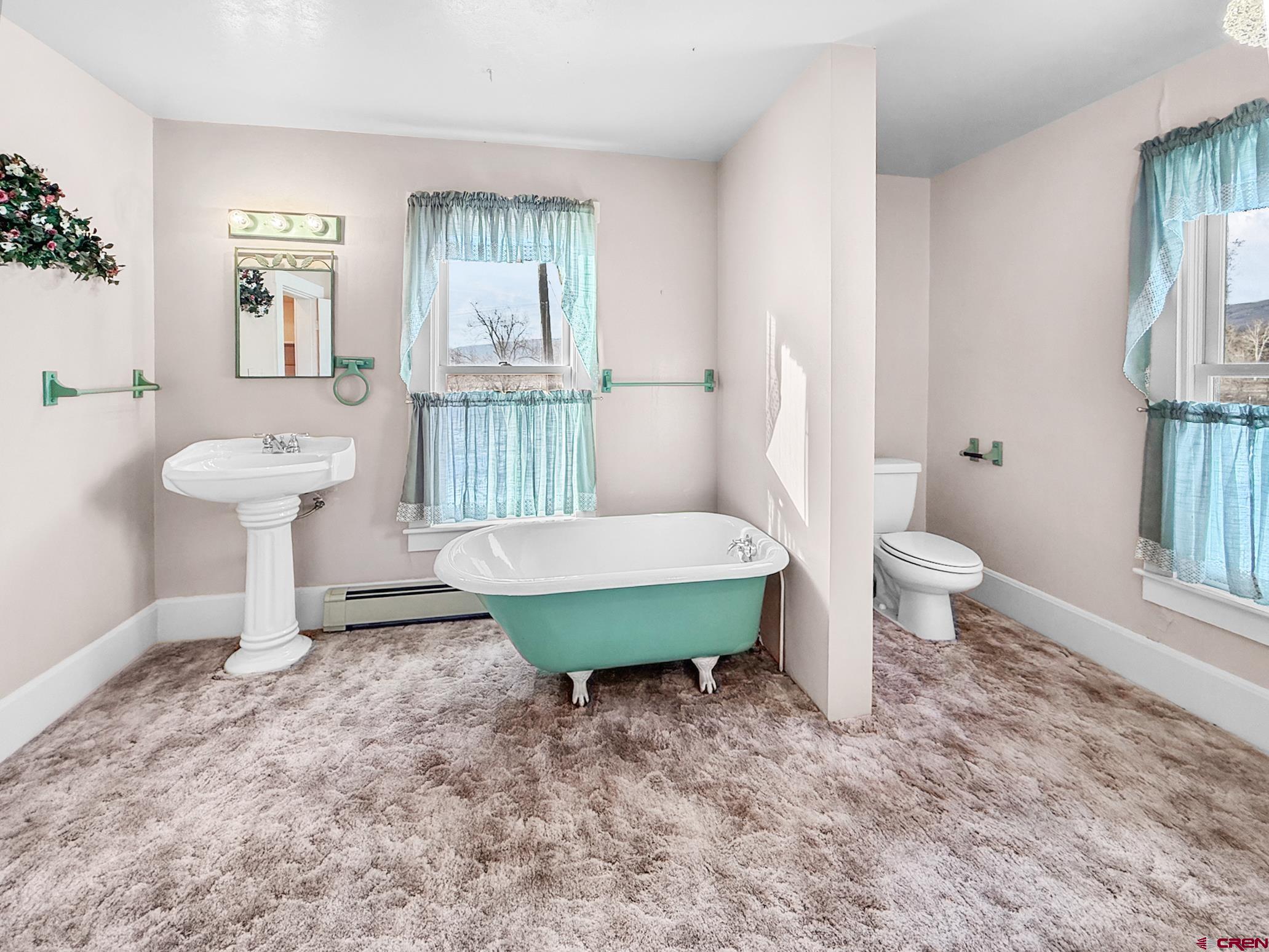 17343 Surface Creek Road Cedaredge, CO 81413 - Photo 15 of 45 a view of a room with wooden floor windows and wooden floor