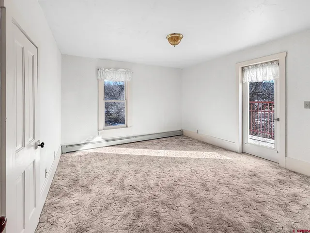 a view of large trees with a big yard