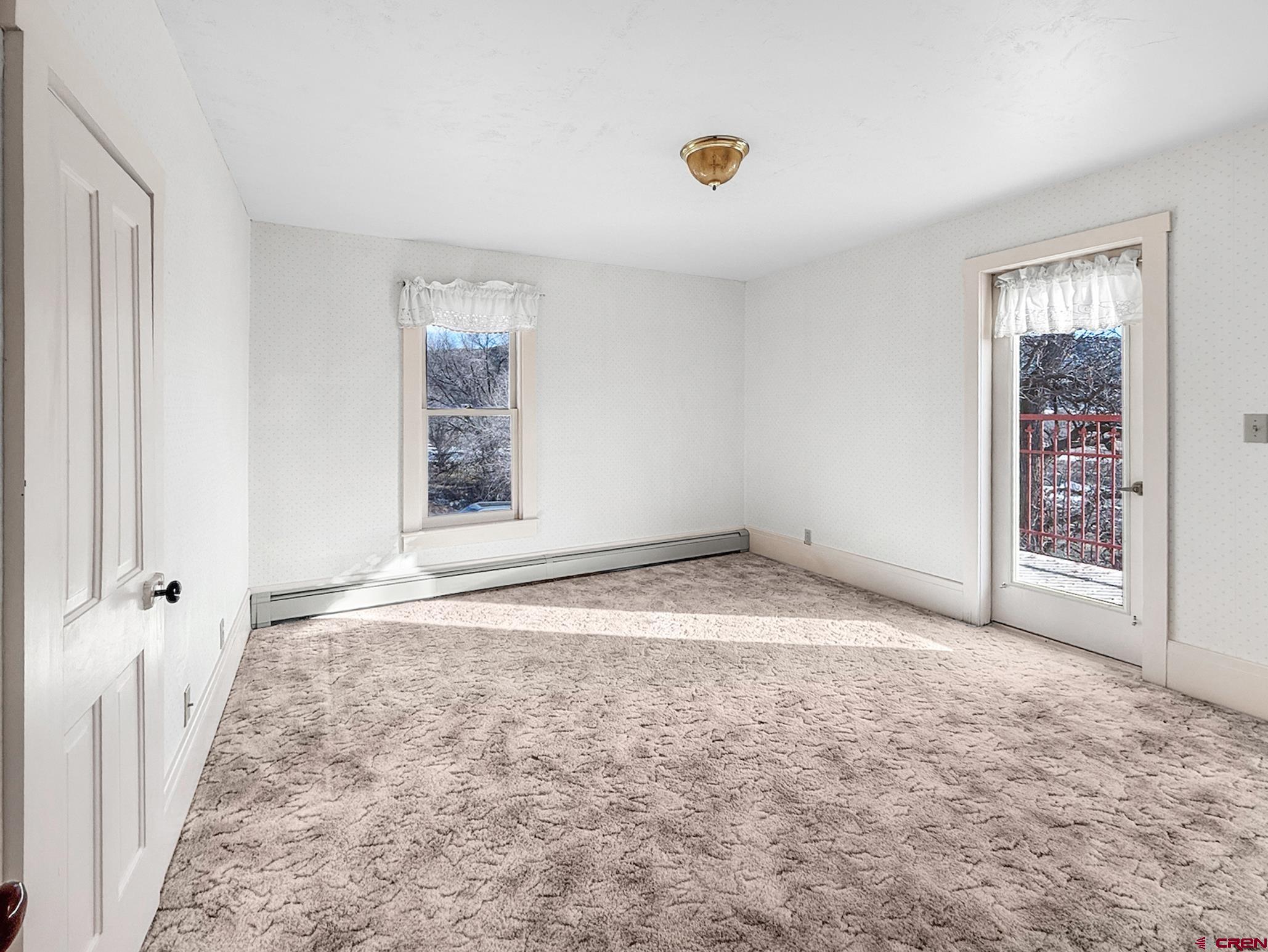 17343 Surface Creek Road Cedaredge, CO 81413 - Photo 16 of 45 an empty room with windows