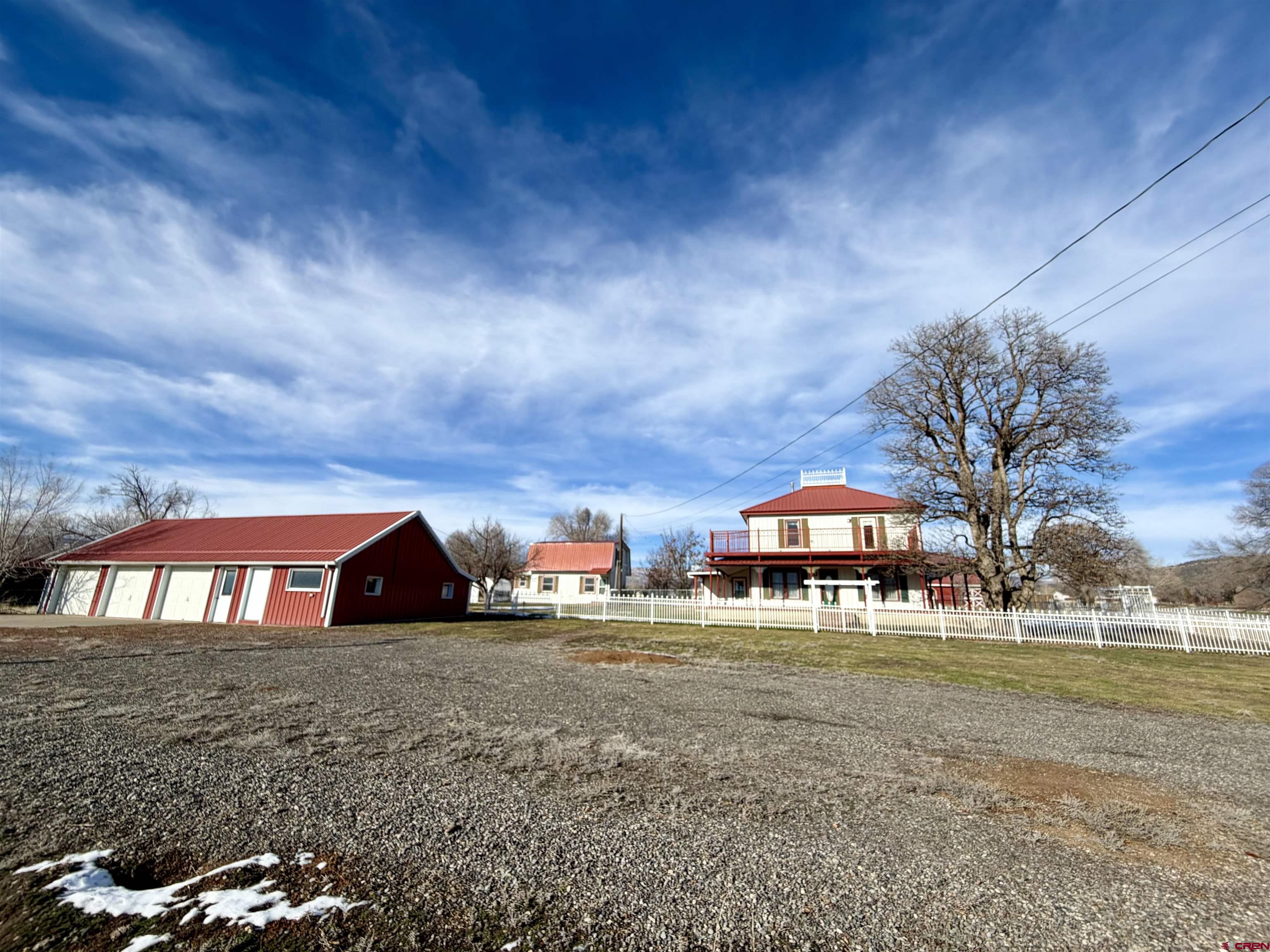 17343 Surface Creek Road Cedaredge, CO 81413 - Photo 17 of 45 a view of large trees with a big yard