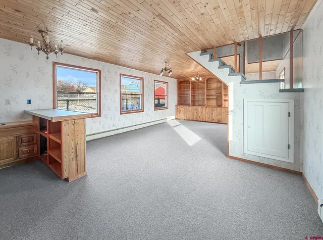 a bathroom with a toilet and shower curtain