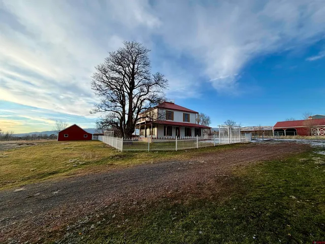 a view of a backyard of the house