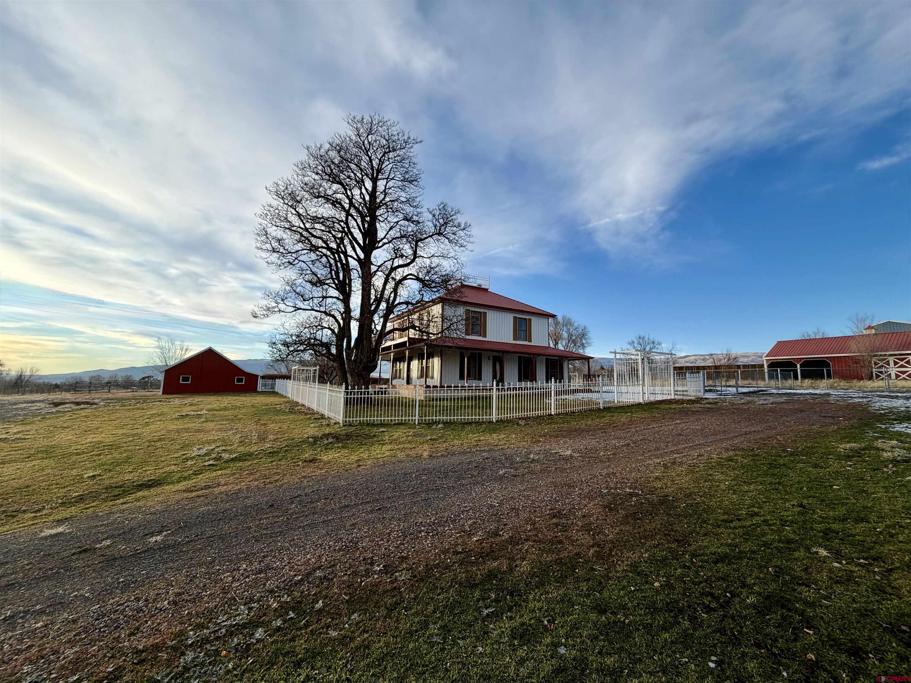 17343 Surface Creek Road Cedaredge, CO 81413 - Photo 24 of 45 a front view of a house with a yard