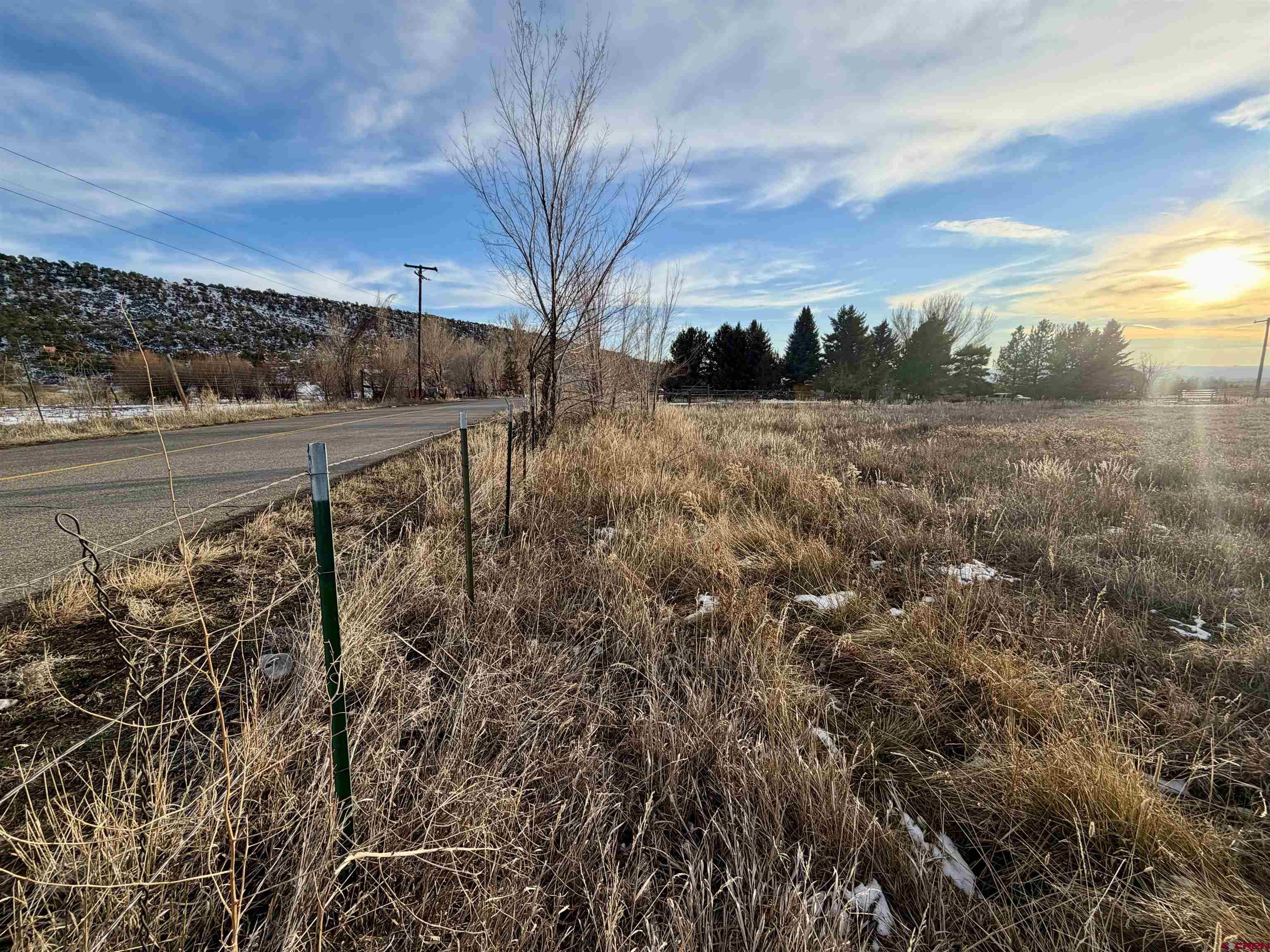 17343 Surface Creek Road Cedaredge, CO 81413 - Photo 30 of 45 a view of a yard with wooden fence