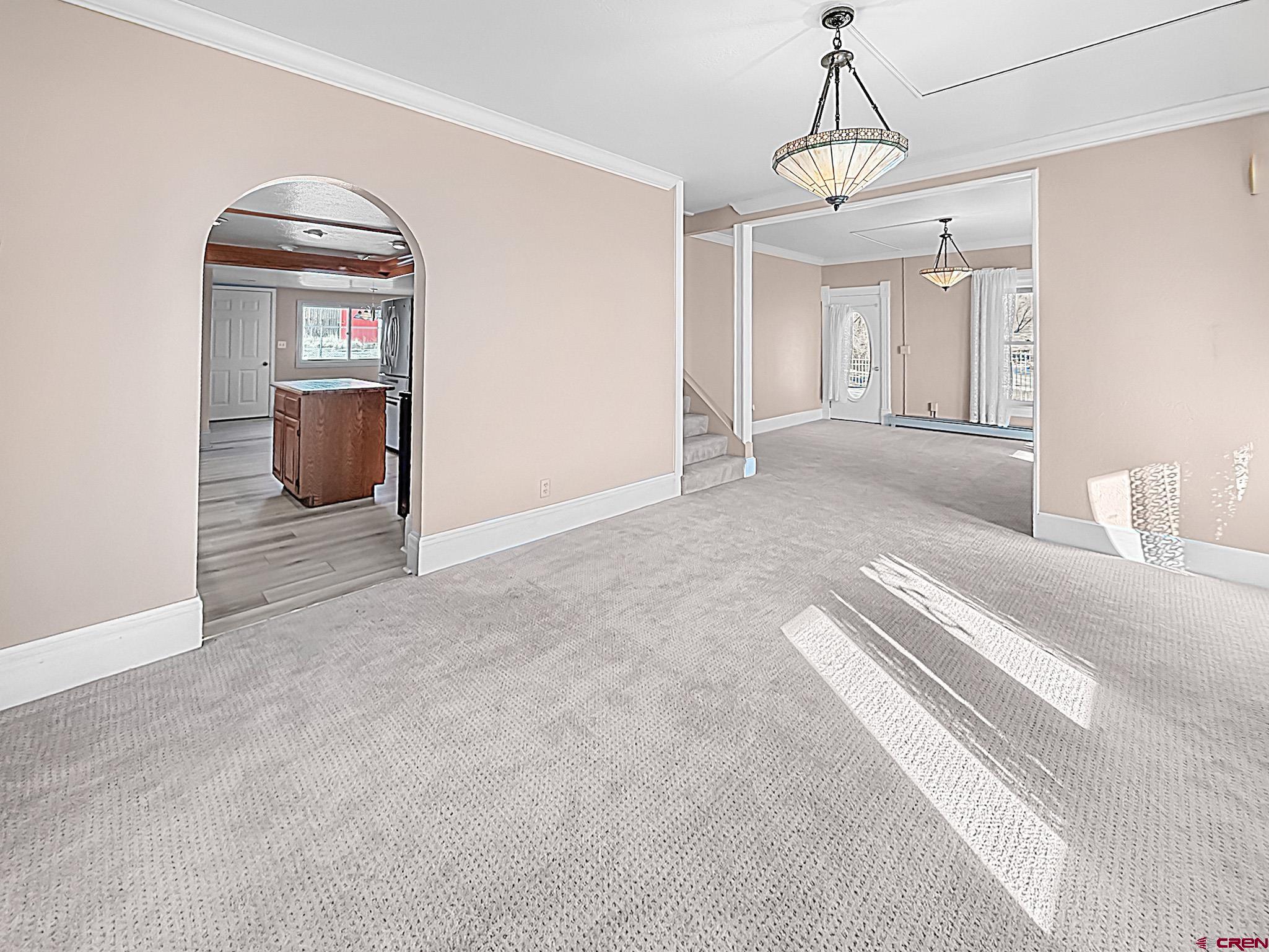 17343 Surface Creek Road Cedaredge, CO 81413 - Photo 3 of 45 a view of a hallway with wooden floor and cabinet
