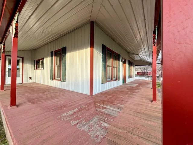 a view of a house with a yard from a balcony