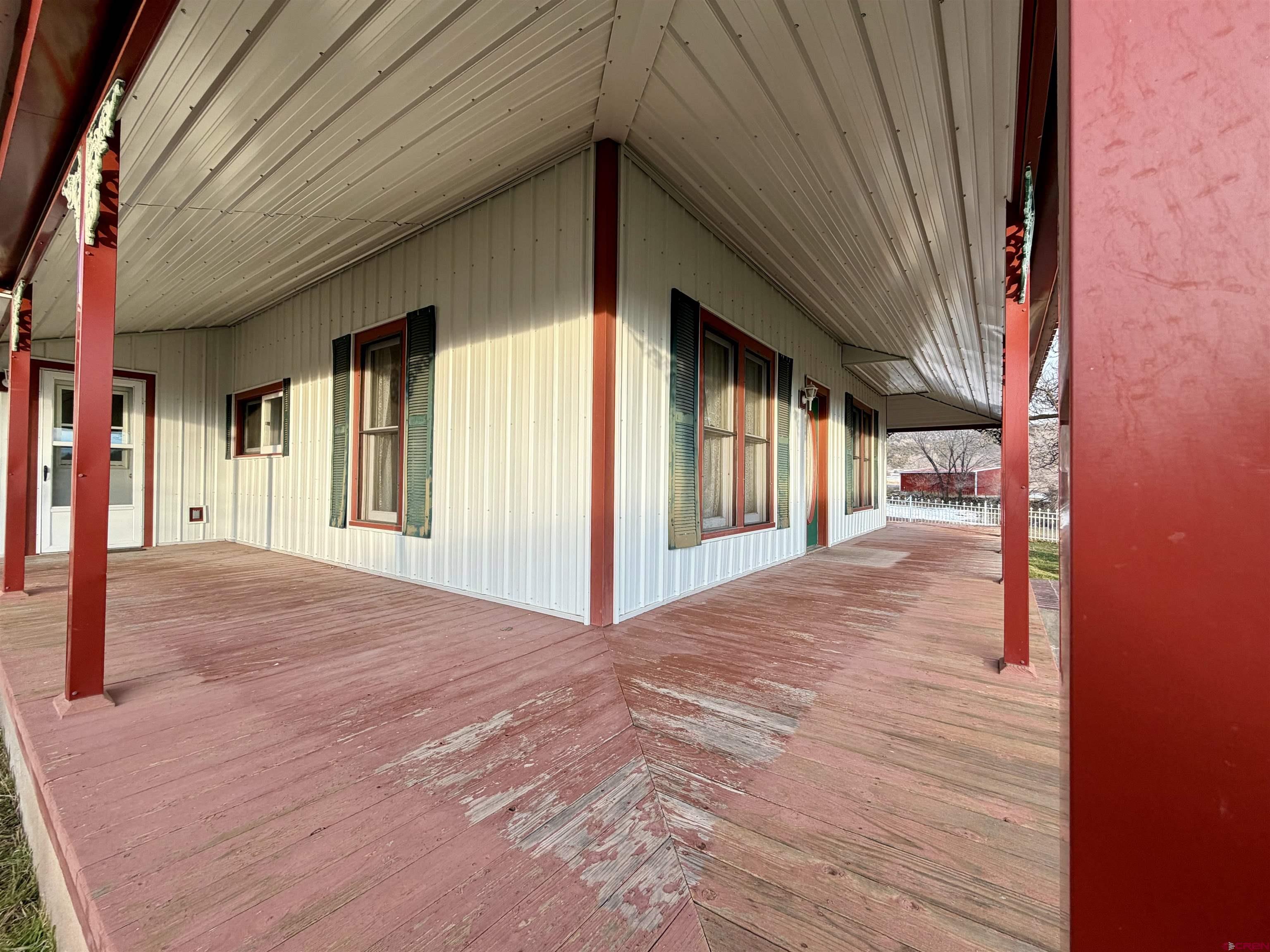 17343 Surface Creek Road Cedaredge, CO 81413 - Photo 35 of 45 a view of a porch of a house