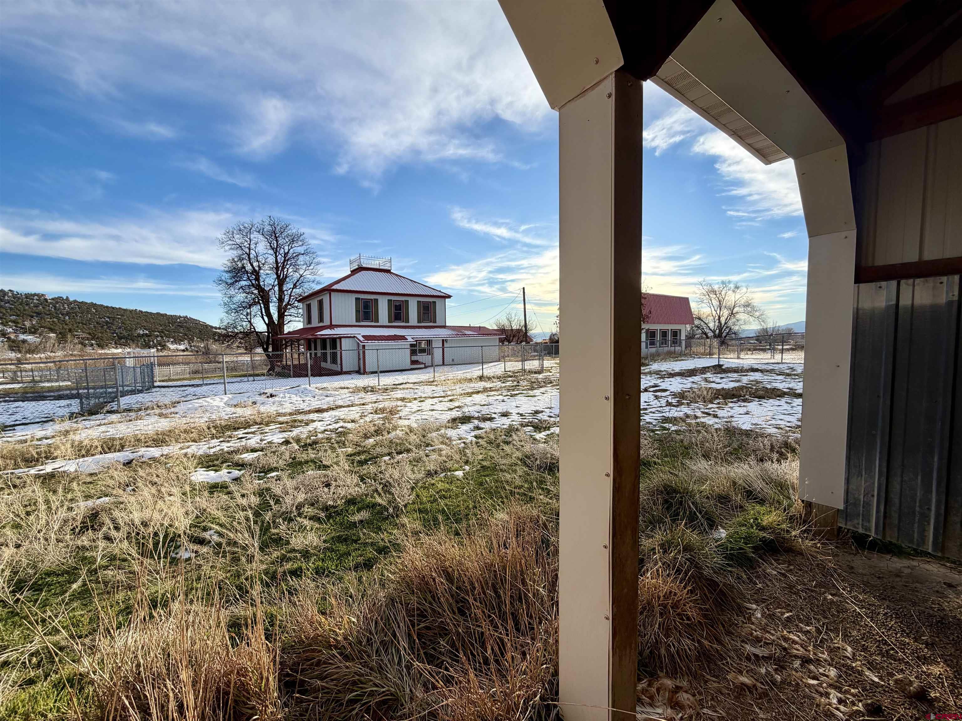 17343 Surface Creek Road Cedaredge, CO 81413 - Photo 38 of 45 a view of a house with a yard from a balcony