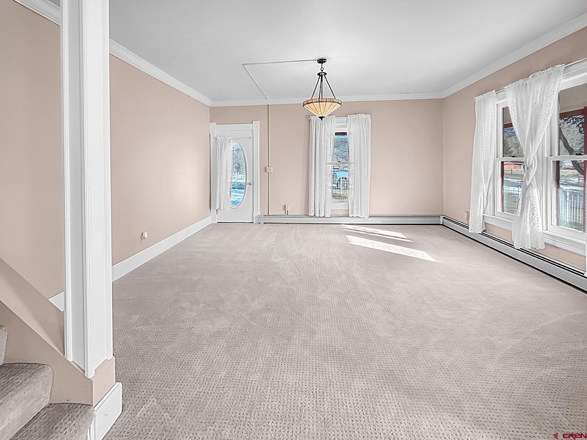 17343 Surface Creek Road Cedaredge, CO 81413 - Photo 4 of 45 a view of an empty room with a window