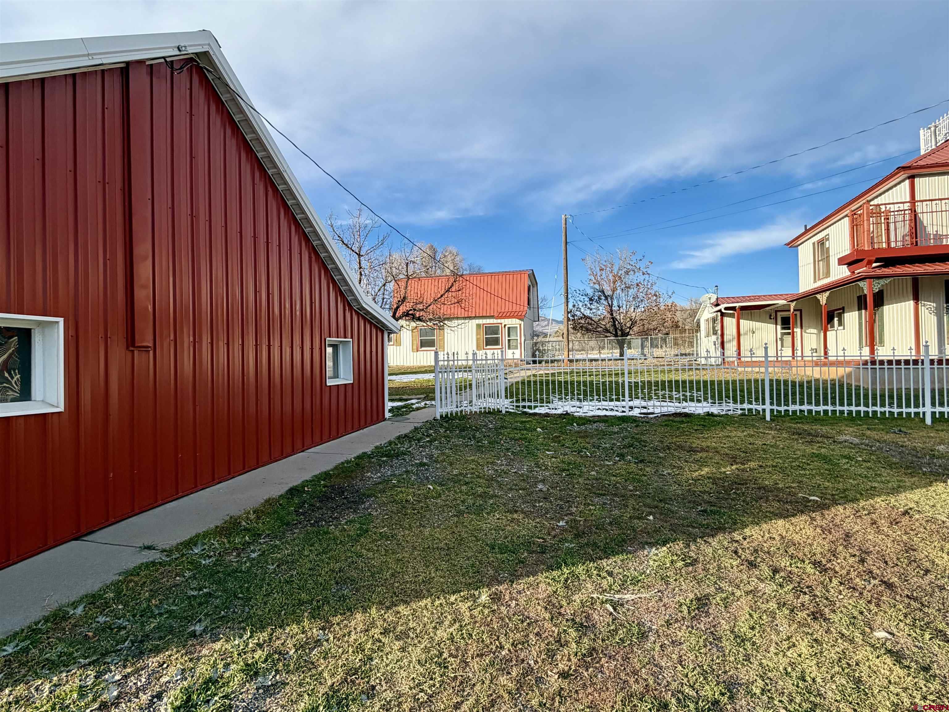 17343 Surface Creek Road Cedaredge, CO 81413 - Photo 42 of 45 a view of a house with a yard