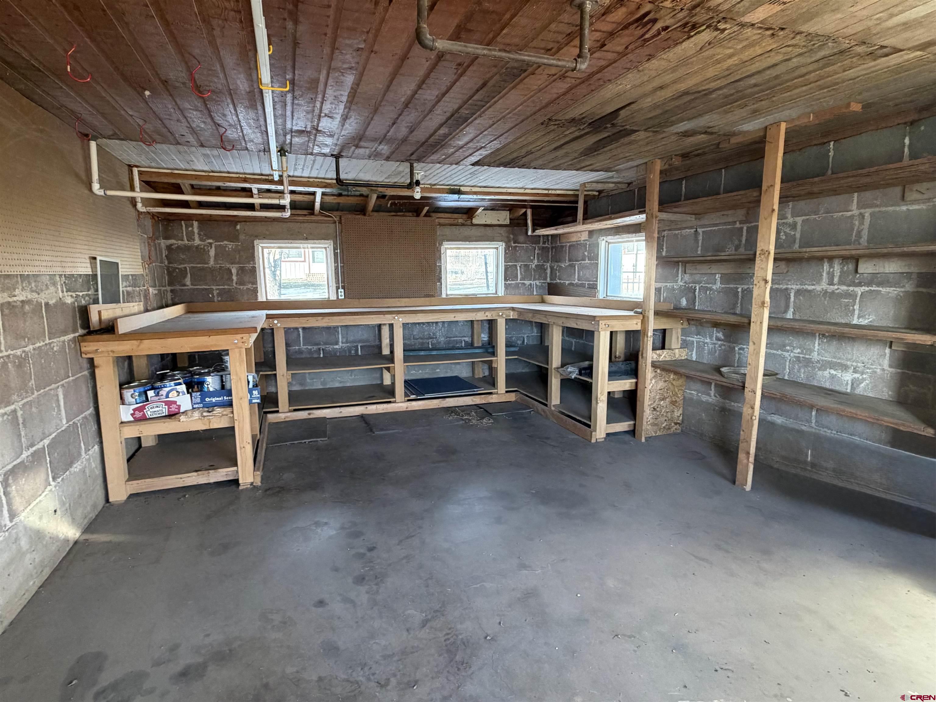 17343 Surface Creek Road Cedaredge, CO 81413 - Photo 43 of 45 a view of an empty room with a fireplace