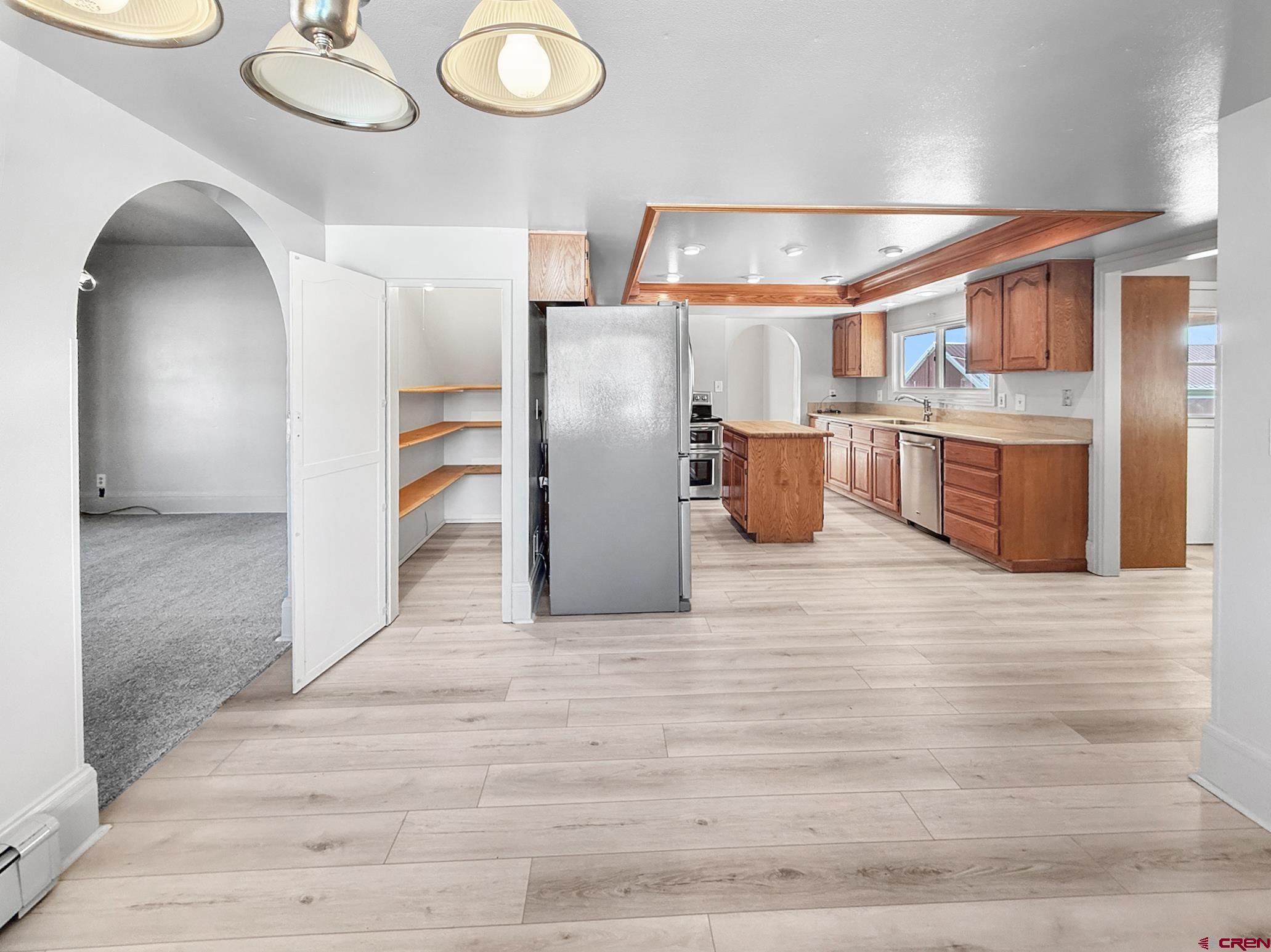 17343 Surface Creek Road Cedaredge, CO 81413 - Photo 7 of 45 a kitchen with stainless steel appliances granite countertop a sink and cabinets