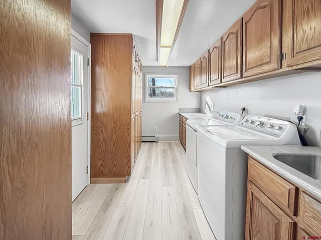 a view of a kitchen with electric appliances