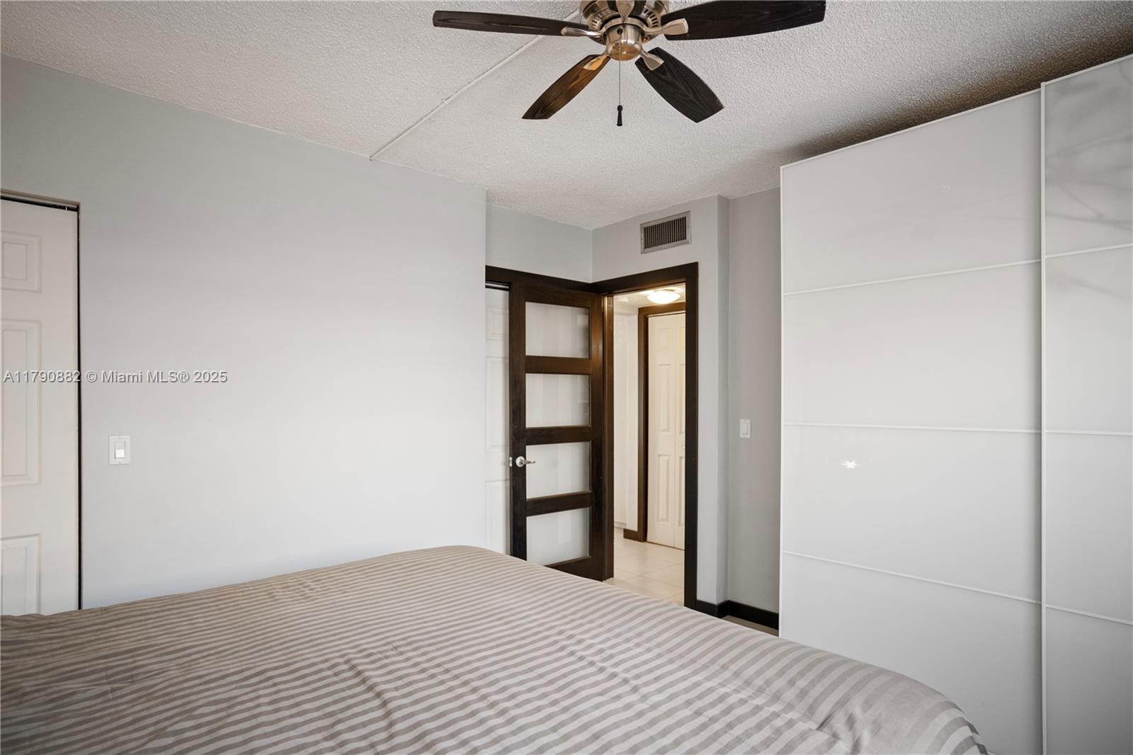 901 South Surf Road, Unit 603 Hollywood, FL 33019 - Photo 11 of 26 a bedroom with a bed and a window
