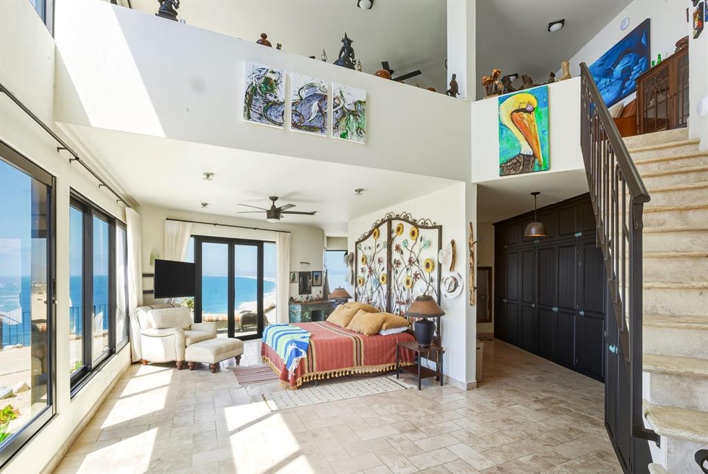 1 Arriba De Lane Roca, OUTSIDE OF THE US 99999 - Photo 12 of 40 a bedroom with furniture and a large window