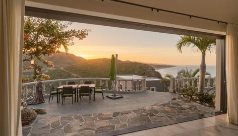 swimming pool view with a lake view