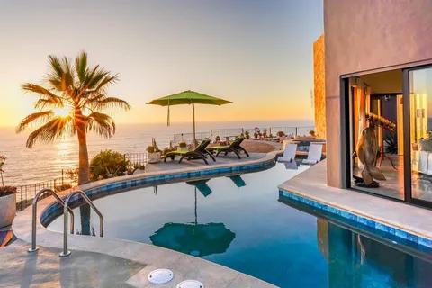 a bathroom with a double vanity sink and mirror