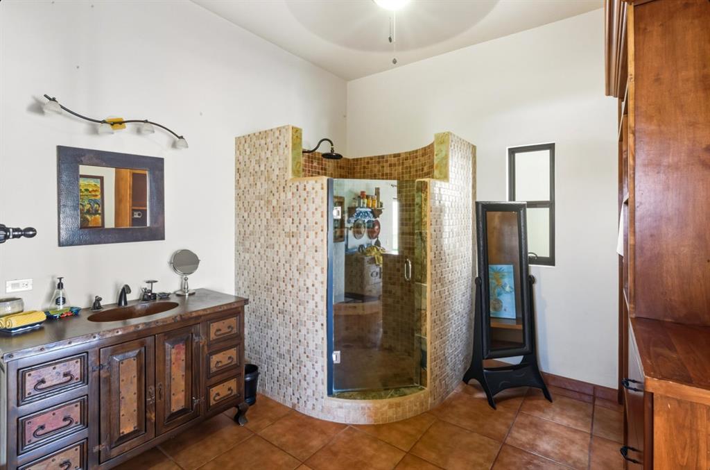 1 Arriba De Lane Roca, OUTSIDE OF THE US 99999 - Photo 22 of 40 a bathroom with a double vanity sink and mirror