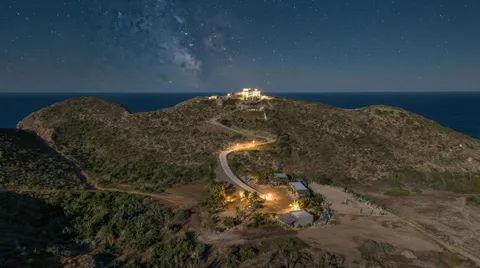 a balcony with table and chairs