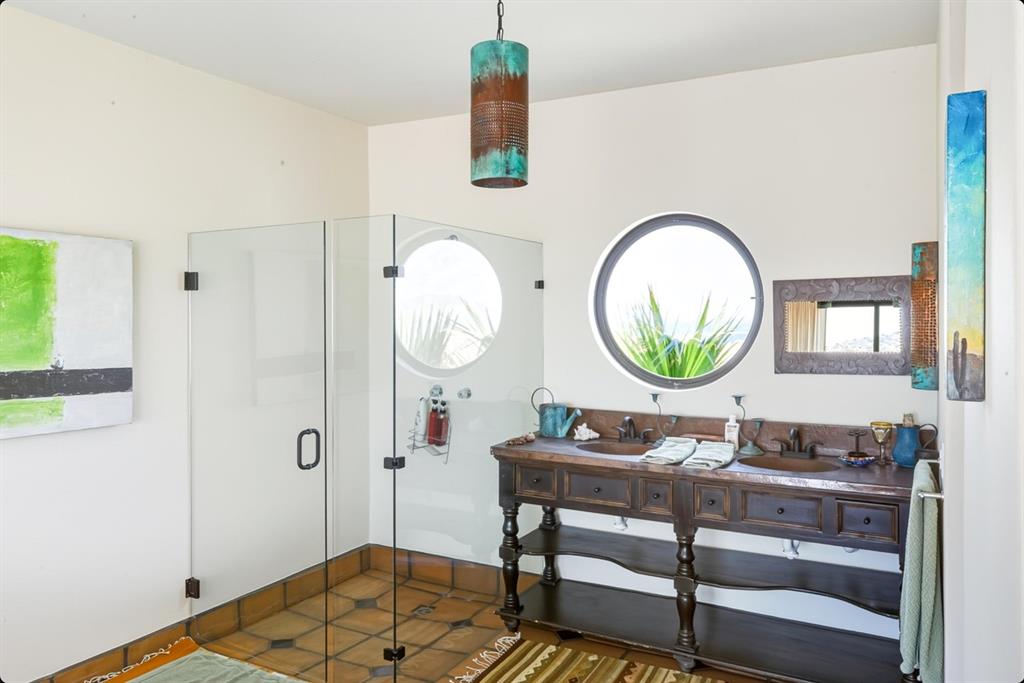 1 Arriba De Lane Roca, OUTSIDE OF THE US 99999 - Photo 32 of 40 Bathroom with a shower stall and double vanity